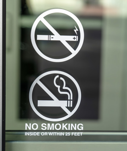 Glass window of a building with No Smoking sign